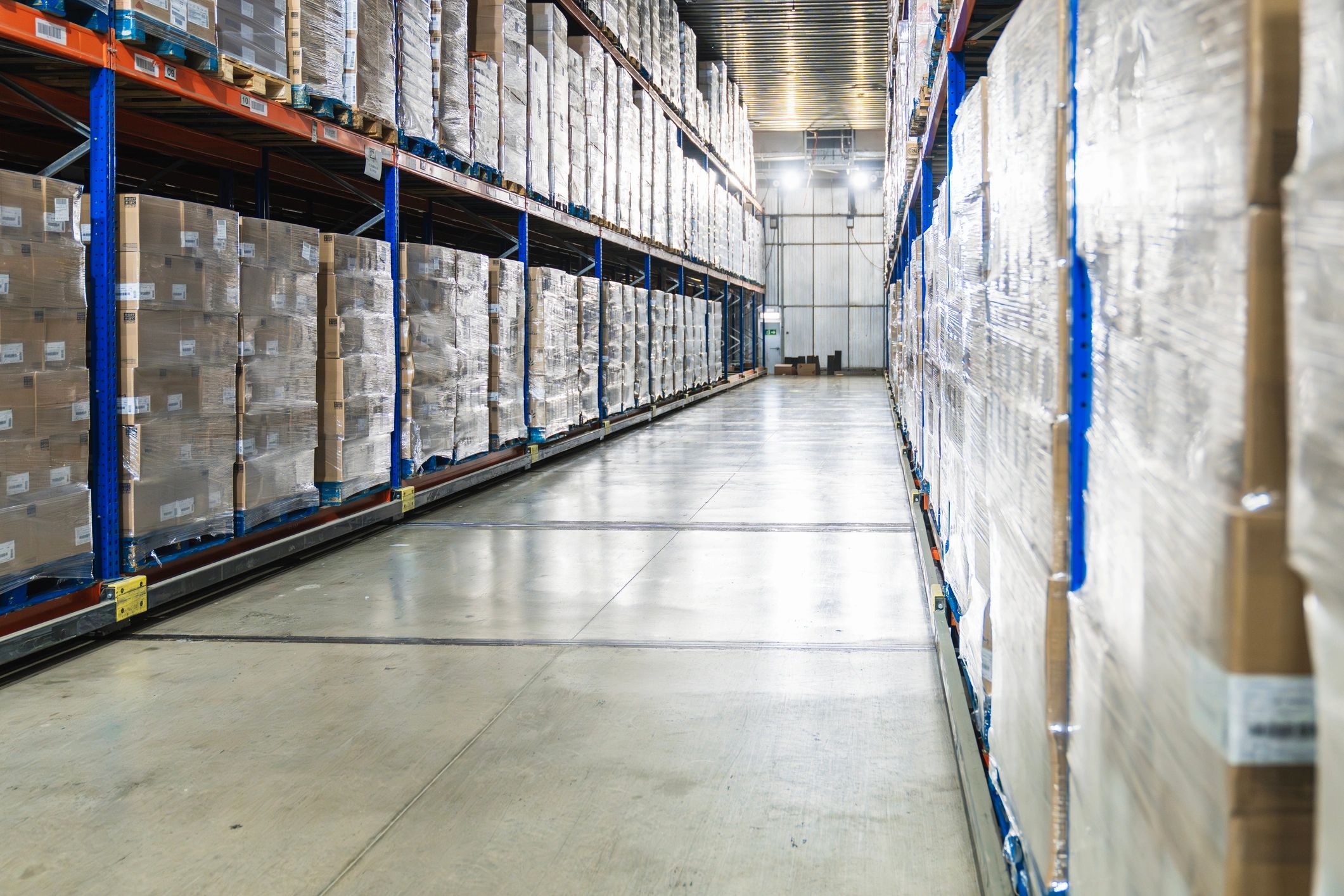 Logistics warehouse aisle representing EU distribution and scale-up operations